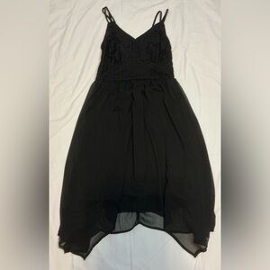 Short black spaghetti strap dress with handkerchief style bottom